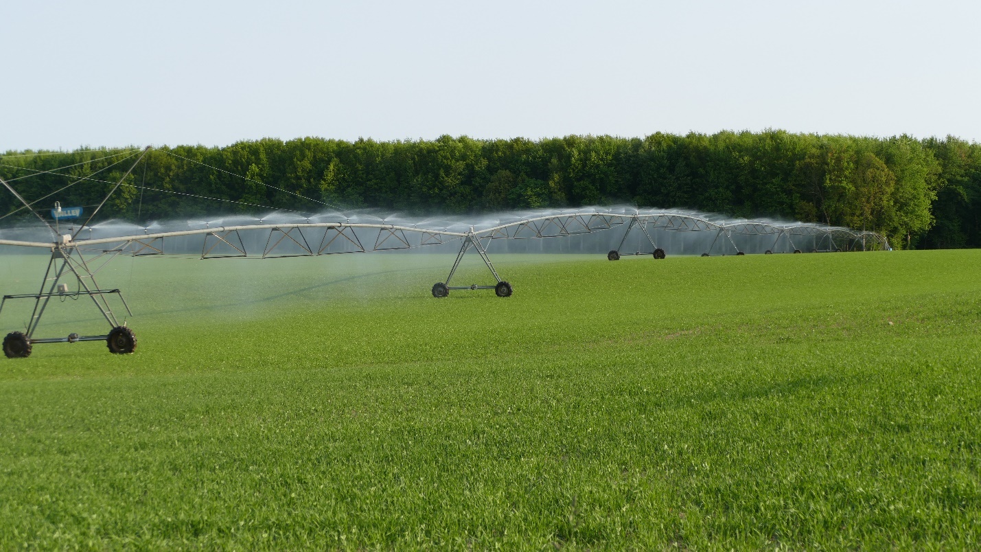 An irrigator spraying water onto a field.